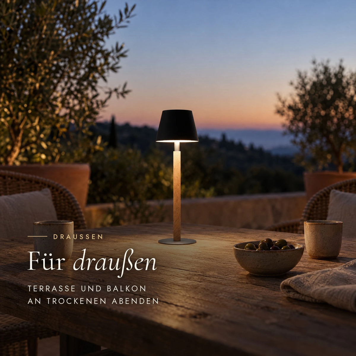 Cordless Nala table lamp on the terrace, a rechargeable light for balcony and garden on dry evenings