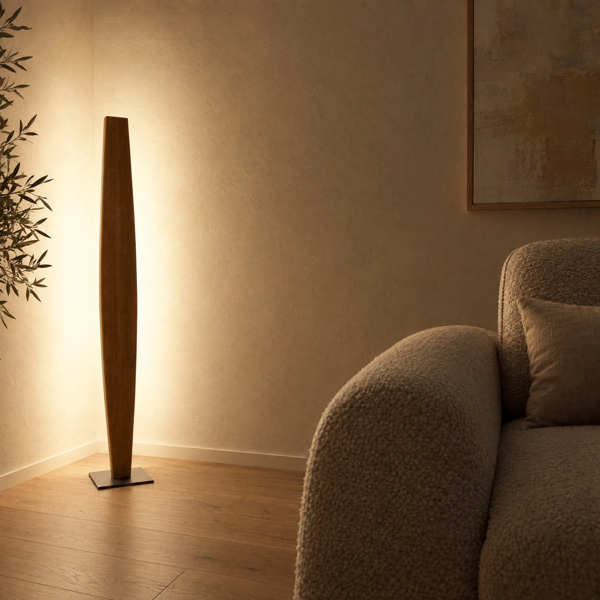 Spindle-shaped Stella oak floor lamp in the corner next to the sofa, indirect light on both walls