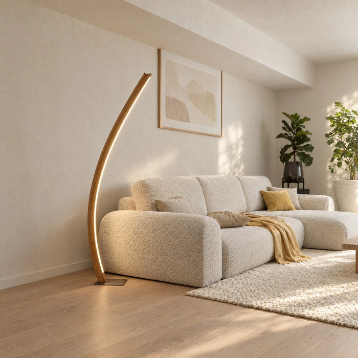 Candor floor lamp in solid oak with a continuous LED light line beside a sofa in the living room