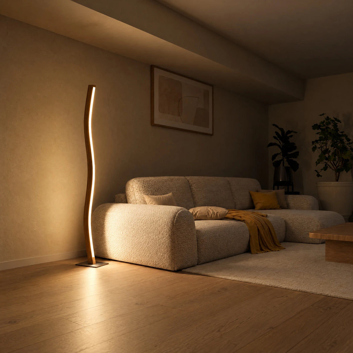 Wave-shaped Nivara oak floor lamp switched on in the evening next to a light sofa in the living room