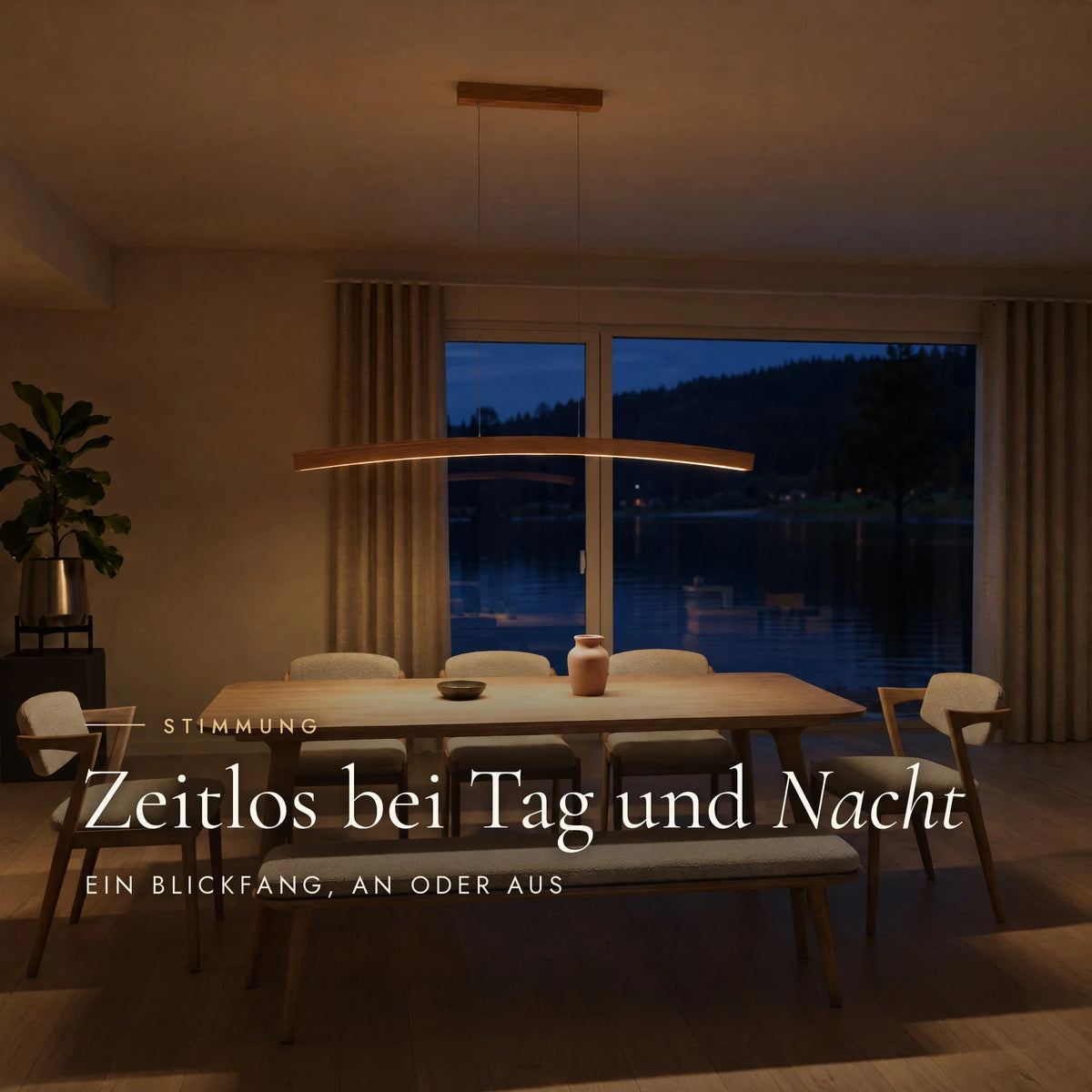 Novara pendant light in the evening: warm light above the dining table, the lake outside at dusk